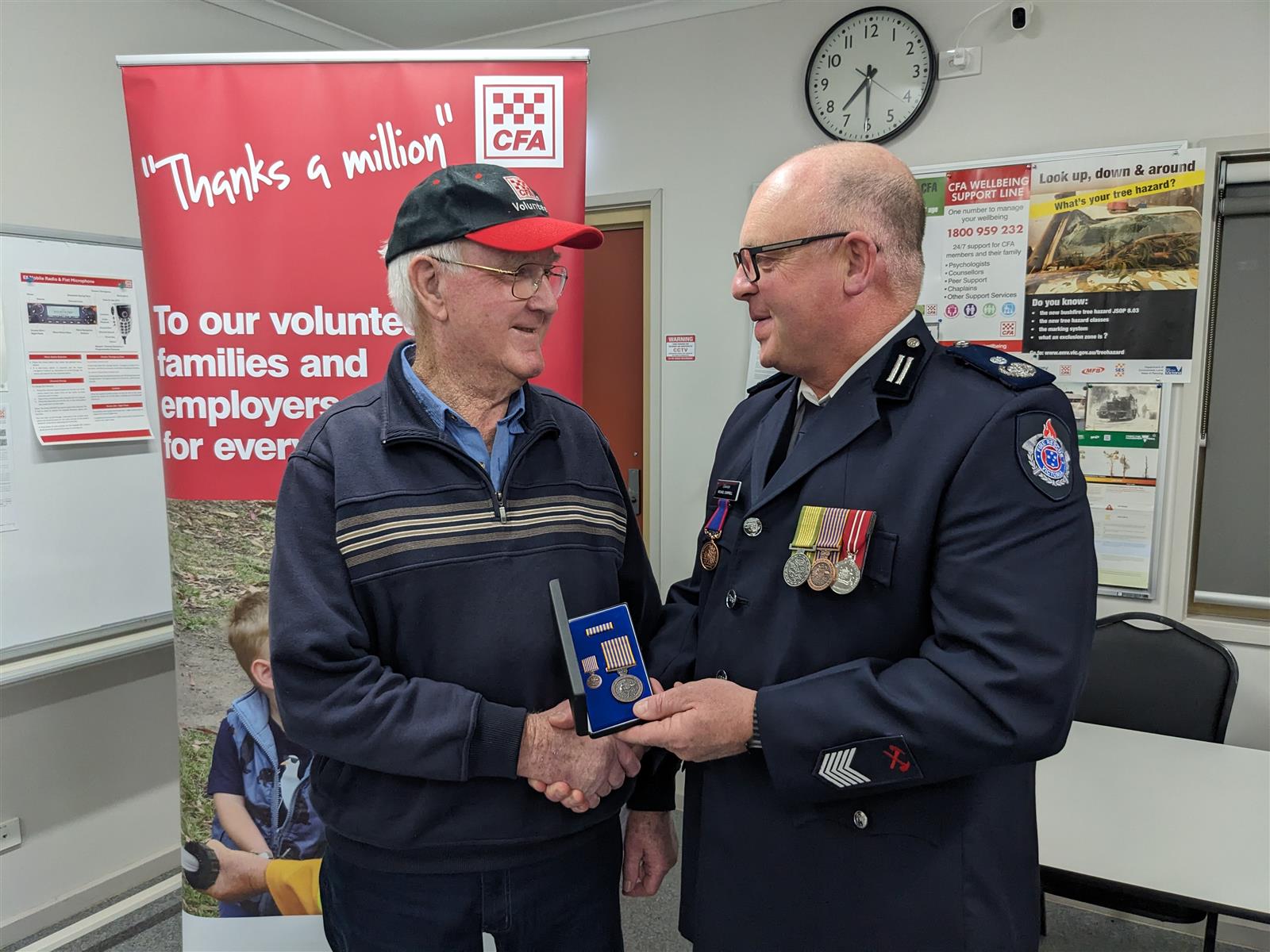 Colin Smith receiving the National Service Medal
